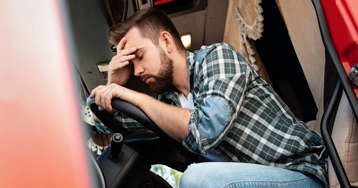 Trucker who is not feeling well due to unhealthy habits during the cold and flu seasons.