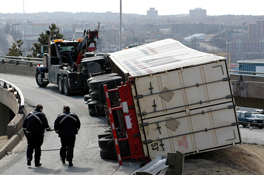 Semi truck turned on it's side