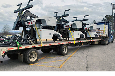 A Buchanan flatbed delivering automotive parts to Mexico.
