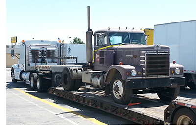 Buchanan transports a collectors semi to a location to be restorred.