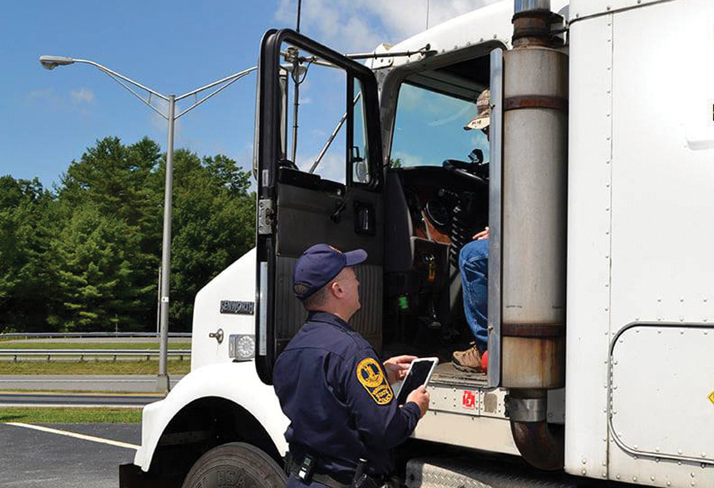 officer inspects a driver