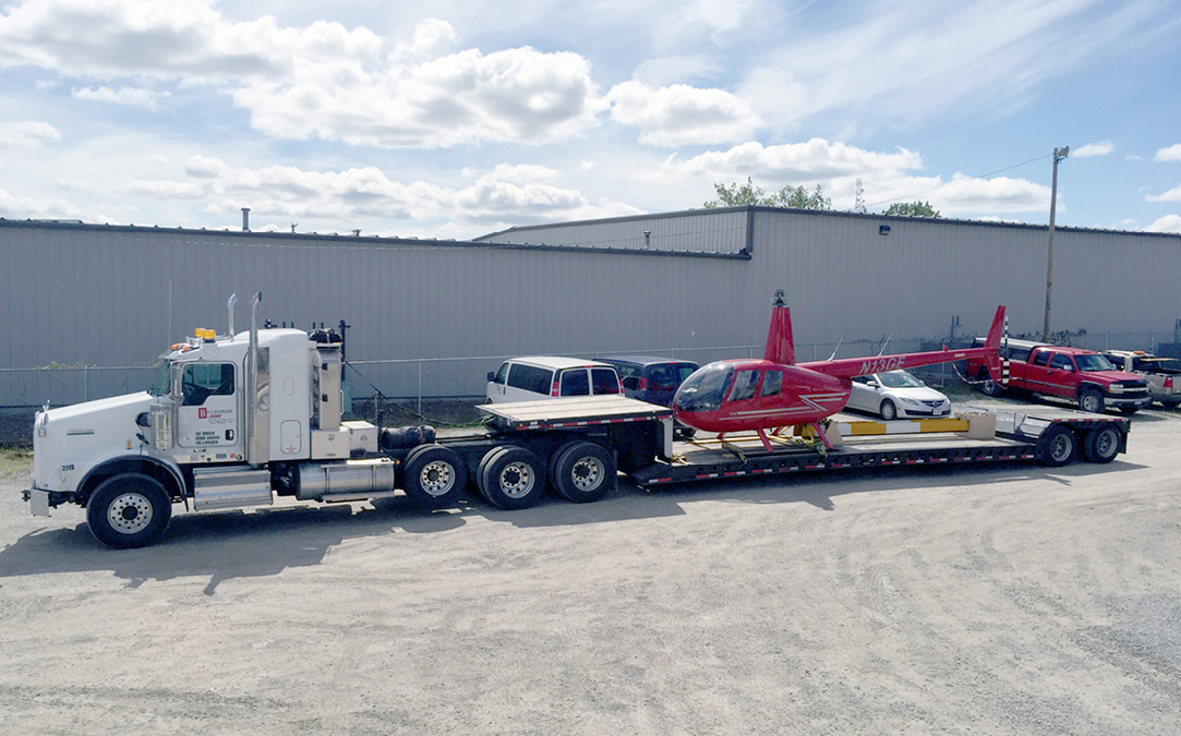 Buchanan Logistics transporting a customer's helicopter with one of our RGN trailers.
