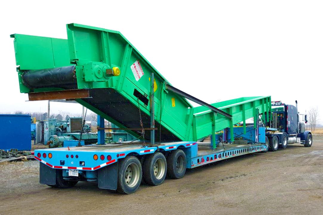 Buchanan Logistics transporting a conveyor system for a facility using their step deck trailer.