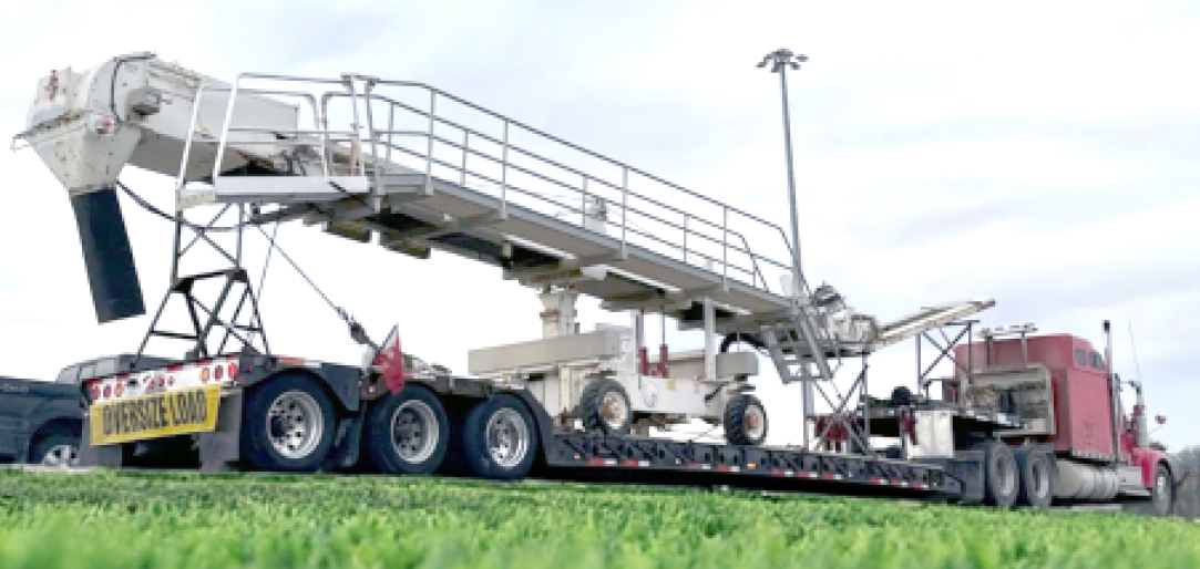 Buchanan Logistics transporting an elevator or conveyor system for a facility using their step deck trailer.