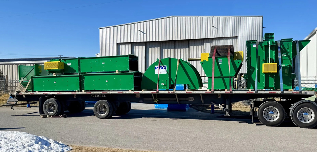 Buchanan Logistics transporting an elevator system for a facility using their step deck trailer.