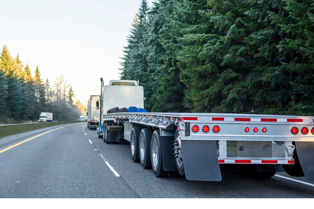 Buchanan Logistics flatbed picking up freight to transport nationwide.