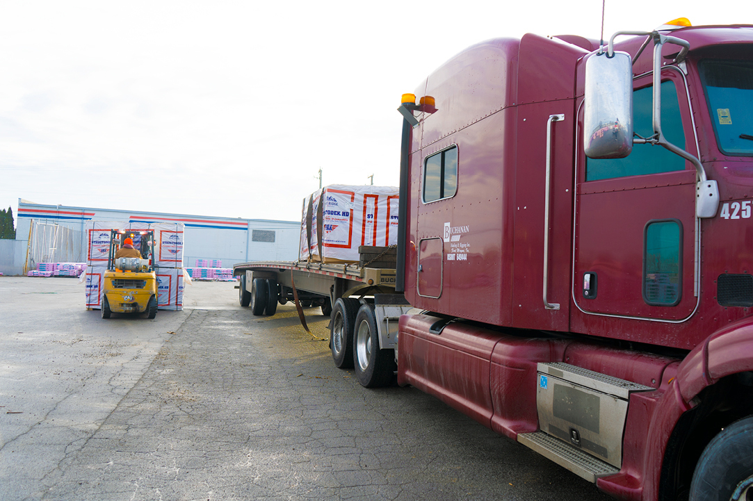 Buchanan Logistics transporting building materials to a retail chain with their flatbed.